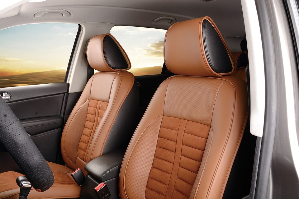 Automotive seats with PU foam headrests