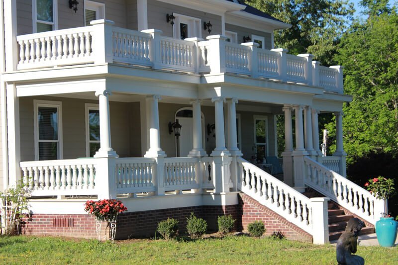 PU wood-imitation balustrades and columns on a building