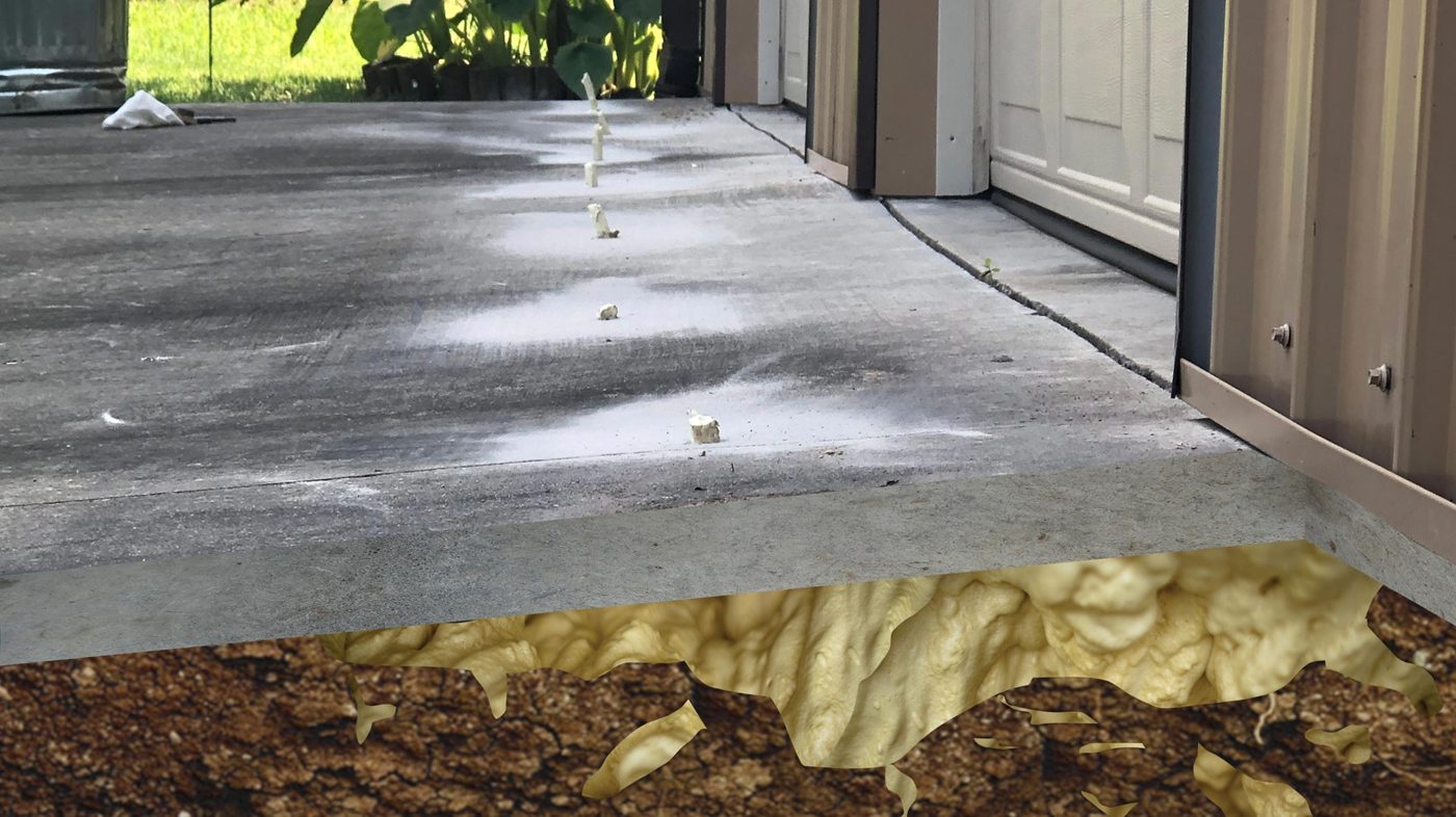 PU foam lifting a settled driveway and garage slab